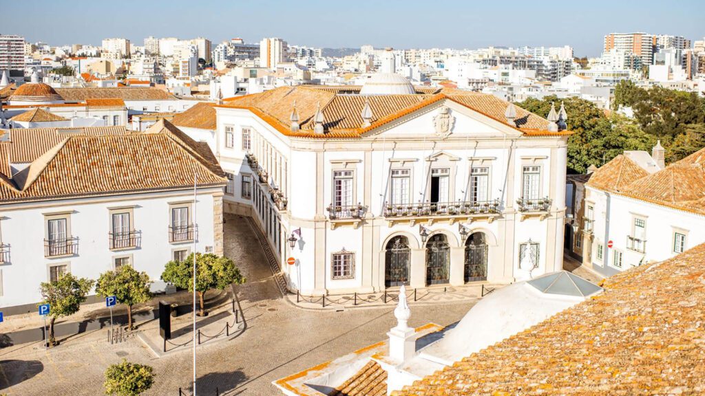Top cityscape view on the old town with beautiful rooftops in Faro on the south of Portugal